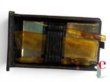 two combs in a black box on a white surface