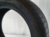 a close up of a tire on a white surface with a white background