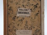 un vieux livre couvert de dessins, posé sur une table