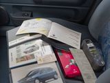 a car seat with a bunch of items on it