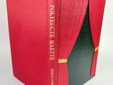 a close up of a red book with a black cover