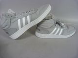 grey and white adidas sneakers on a white background