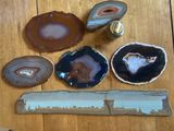 many different types of agate on a wooden table