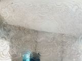 a silver platter with a blue bow on it