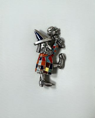 an image of a pin with a man holding a sword