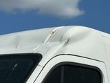 a white van that is parked on the side of the road