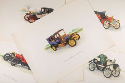 several old cars are lined up in a row on a table