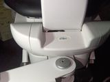 a white toilet with a black seat and a black seat