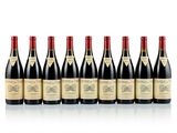 six bottles of red wine lined up in a row