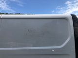 a white van that is parked on the side of the road