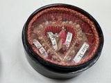 an image of a box with a bunch of bracelets inside of it