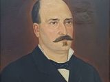 portrait of a man with a mustache and a bow tie