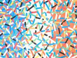 colorful sprinkles are scattered on a white surface