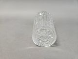 an image of a clear glass bottle sitting on top of a table