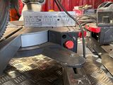 a close up of a machine that is working on a piece of metal