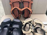 a box with four pairs of sandals on top of it