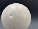 a white ball that is sitting on a table