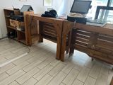 a wooden desk with a laptop on top of it