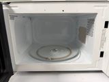 a microwave that has a lid on the inside of it