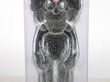 a black bear with a pink nose in a package