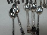 a lot of spoons and spoon spoons sitting on a table