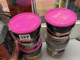 three buckets of paint sitting on the floor next to each other