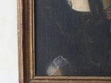 portrait of a woman in a black dress with a red ribbon