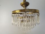 a chandelier hanging from the ceiling in a room