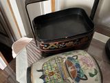 a small box with a painting on it sitting on a table