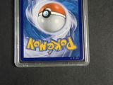 pokemon trading card in plastic case on black surface