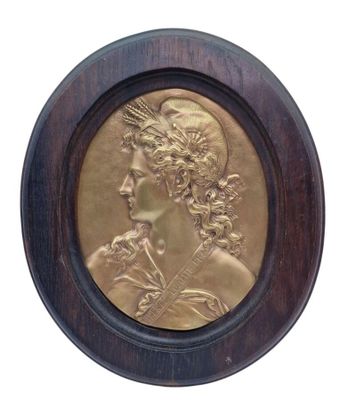 an image of a bronze medallion of a woman