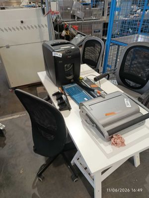 a white table with a laptop and a printer on it