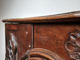 an old wooden table with a mirror on top of it