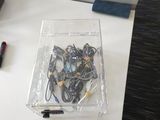 a box of wires and a remote on a table