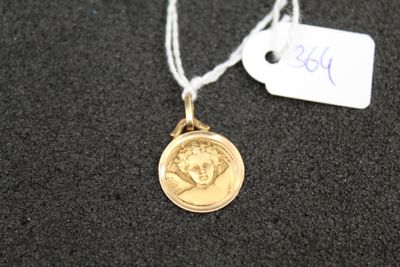 a gold coin with a picture of a woman on it