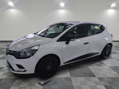 the white car is parked on a checkered floor in the garage