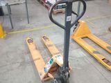a forklift in the middle of a warehouse with boxes on it