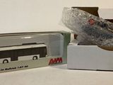 a box with a bus model in it on a table