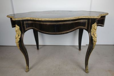 an image of a black and gold table with a marble top