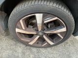 a close up of a tire on a car ' s rim