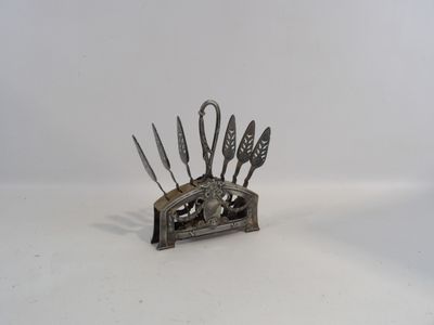 a metal knife holder that has knives in it