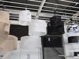 many rolls of toilet paper hanging from the ceiling