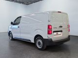 a white van that is parked in a large room