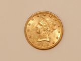 an image of a gold coin with a woman ' s head on it