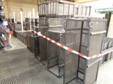 many metal crates lined up in a warehouse