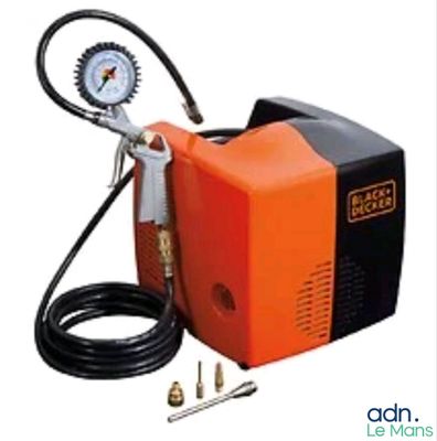 an orange and black portable air compressor with gauge and hose