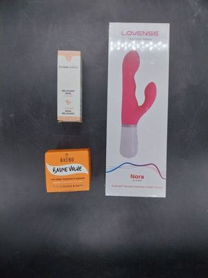 a box of soap, a condom, and a condom on a table