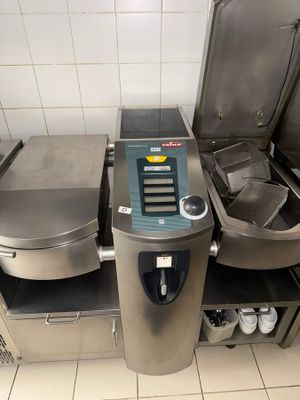 an image of a commercial kitchen with stainless steel appliances