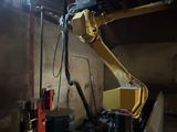 a picture of a machine that is working on a building