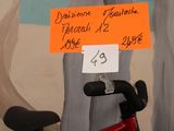 a red scooter with a sign attached to the back of it